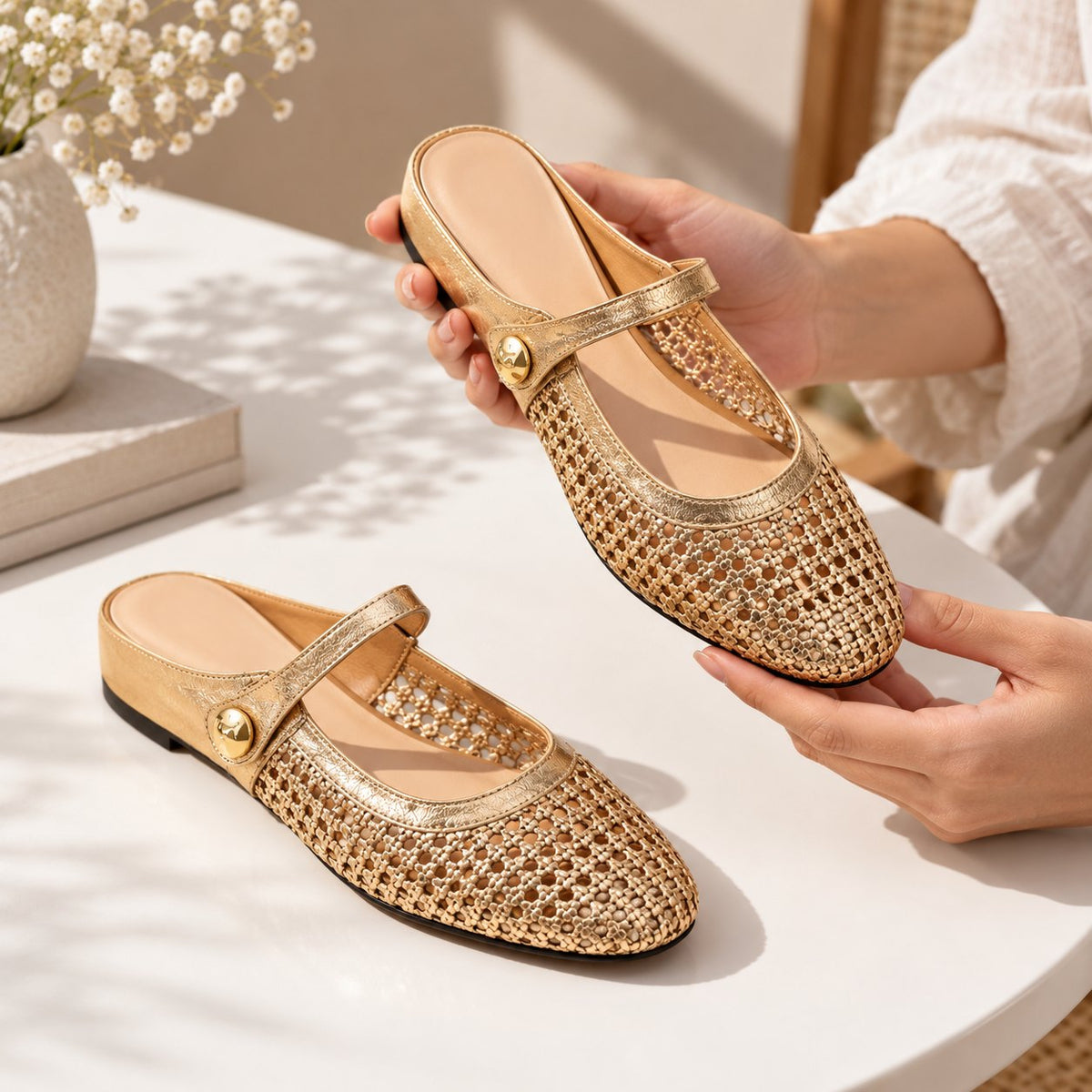 The Woven Mary Jane Mule, gold pair held in hand